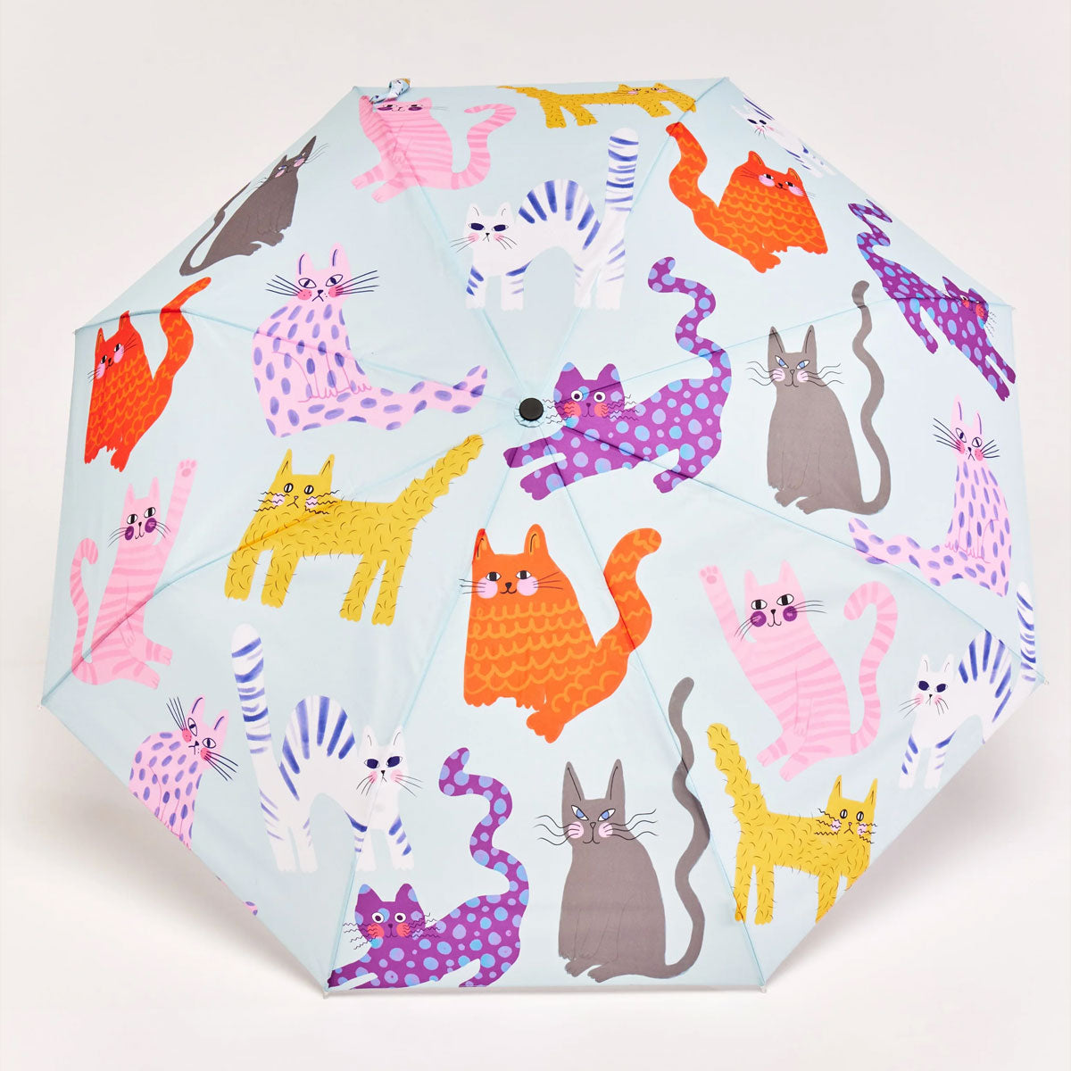 Umbrella with colorful cat pattern on a light blue background