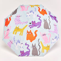 Umbrella with colorful cat pattern on a light blue background