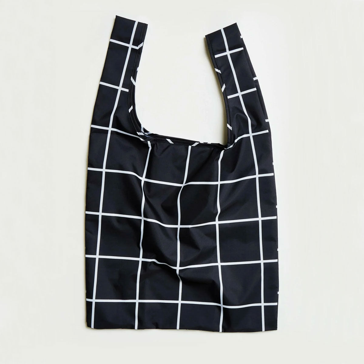 Black reusable bag with white grid pattern on a light gray background