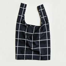 Black reusable bag with white grid pattern on a light gray background