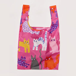 Reusable shopping bag with colorful cat designs on a pink background