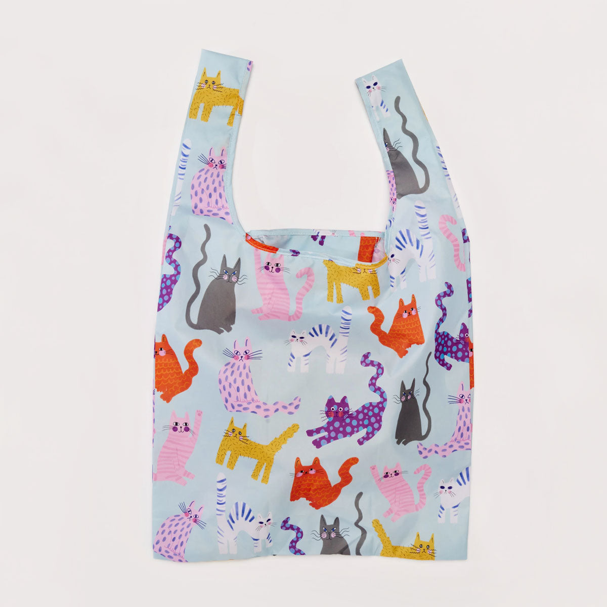 Reusable shopping bag with colorful cat pattern on a light blue background